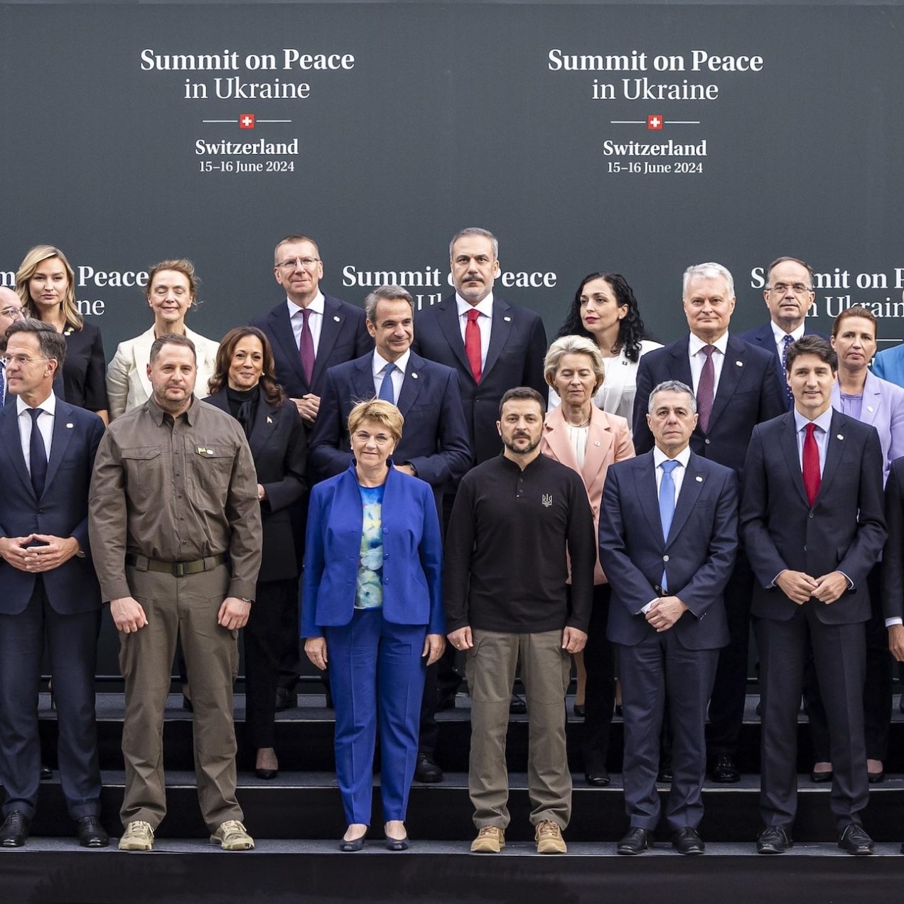 Group photo of world leaders in front of a backdrop saying Summit on Peace in Ukraine